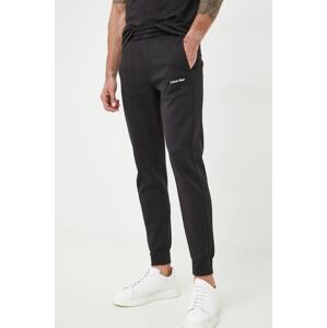 Donji dio trenirke Calvin Klein za muškarce, boja: crna, glatki materijal, K10K109940