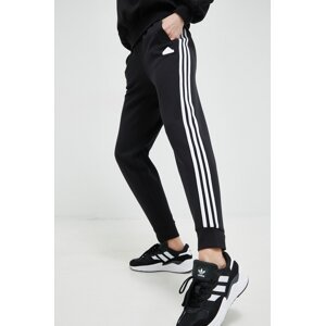 Donji dio trenirke adidas boja: crna, s aplikacijom